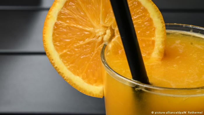 Orange juice with a slice of an orange